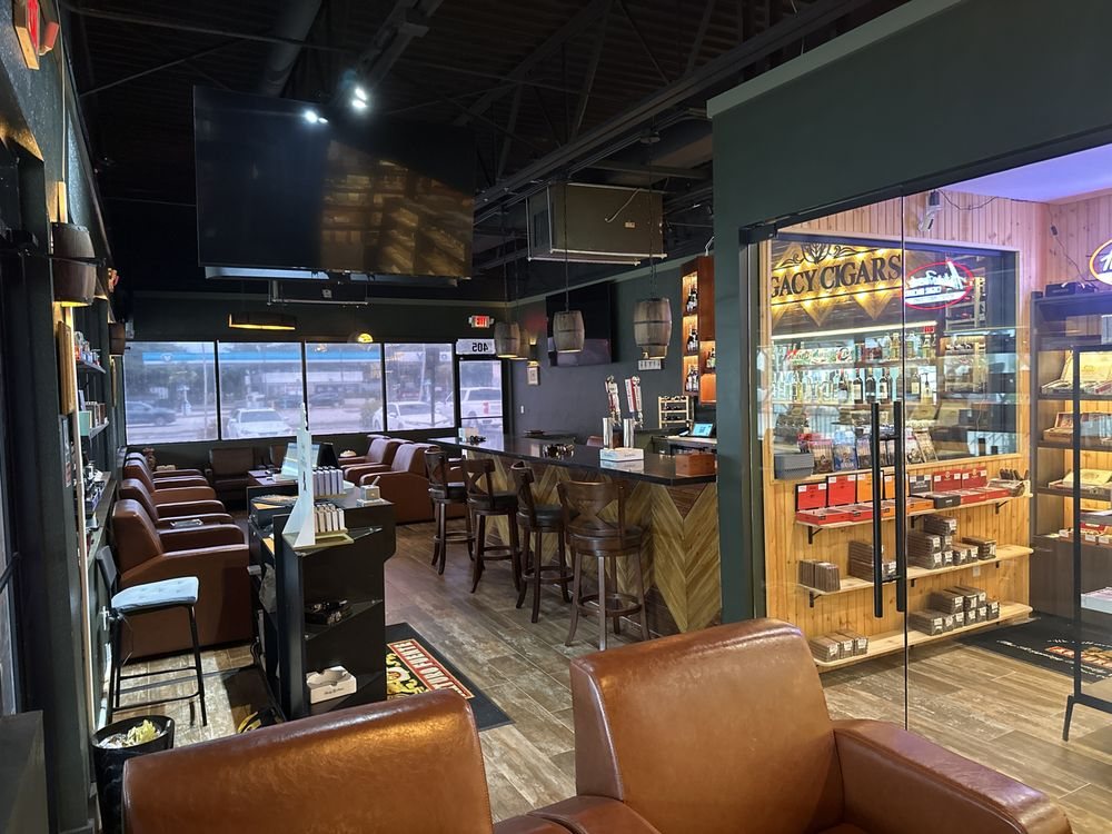 Inside the lounge: leather chairs, the bar and the walk-in humidor